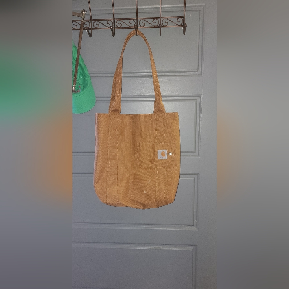 Carhartt tote bag. Blue pinstripes interior with pockets